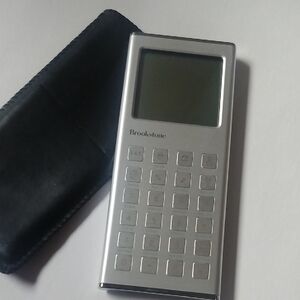Brookstone Wafer Thin Metallic Silver Pocket Calculator with Black Case